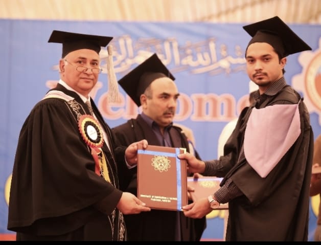 Fawad holding graduation certificate with professors